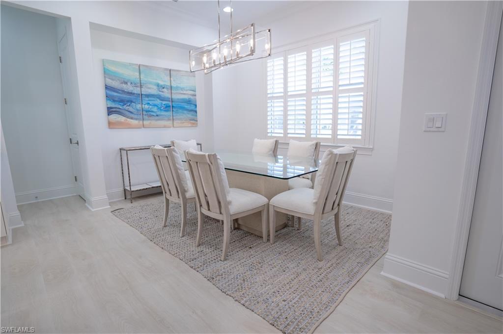 7150 Saona Court Naples, FL 34113 - Photo 14 of 31 a view of a dining room with furniture window and outside view