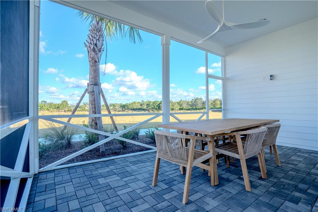 7150 Saona Court Naples, FL 34113 - Photo 16 of 31 a view of a dining room with furniture window and outside view