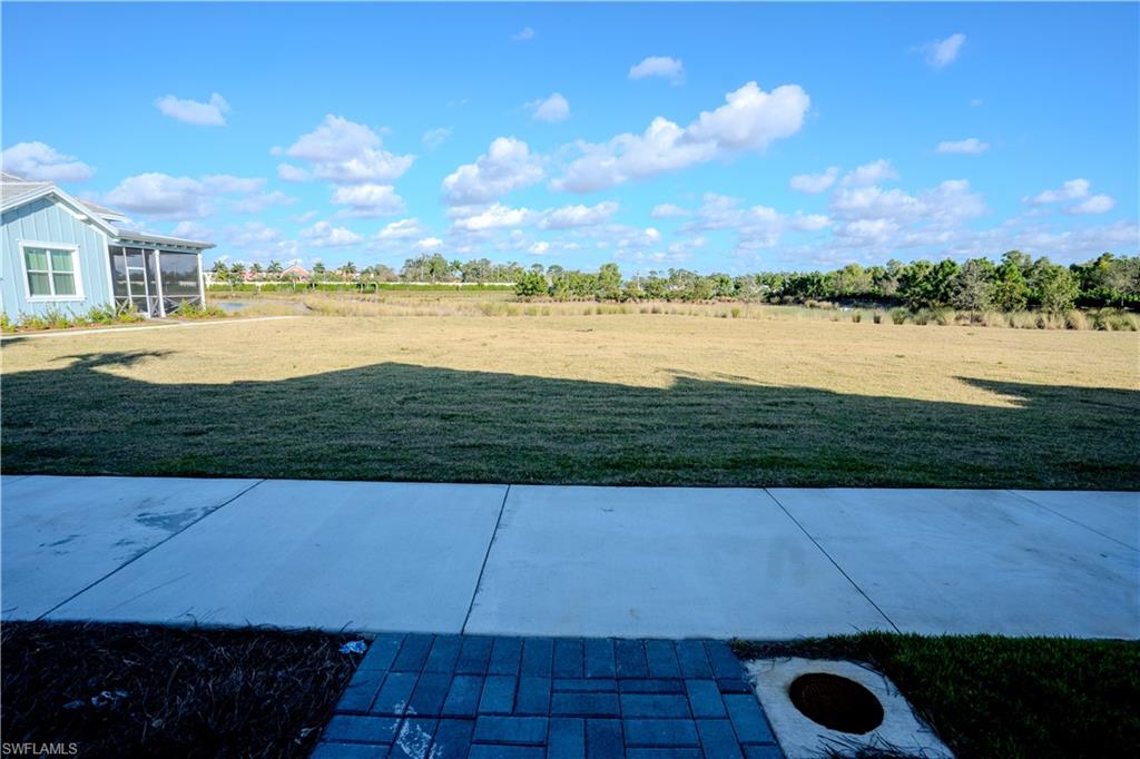 7150 Saona Court Naples, FL 34113 - Photo 17 of 31 a view of a lake