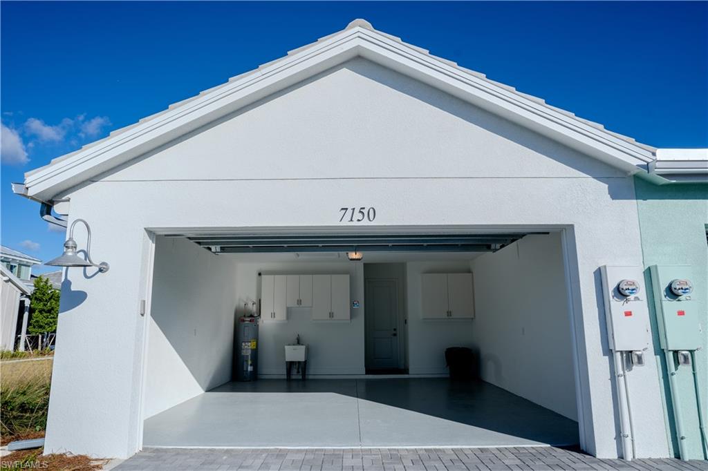 7150 Saona Court Naples, FL 34113 - Photo 19 of 31 a view of a entryway door of the house