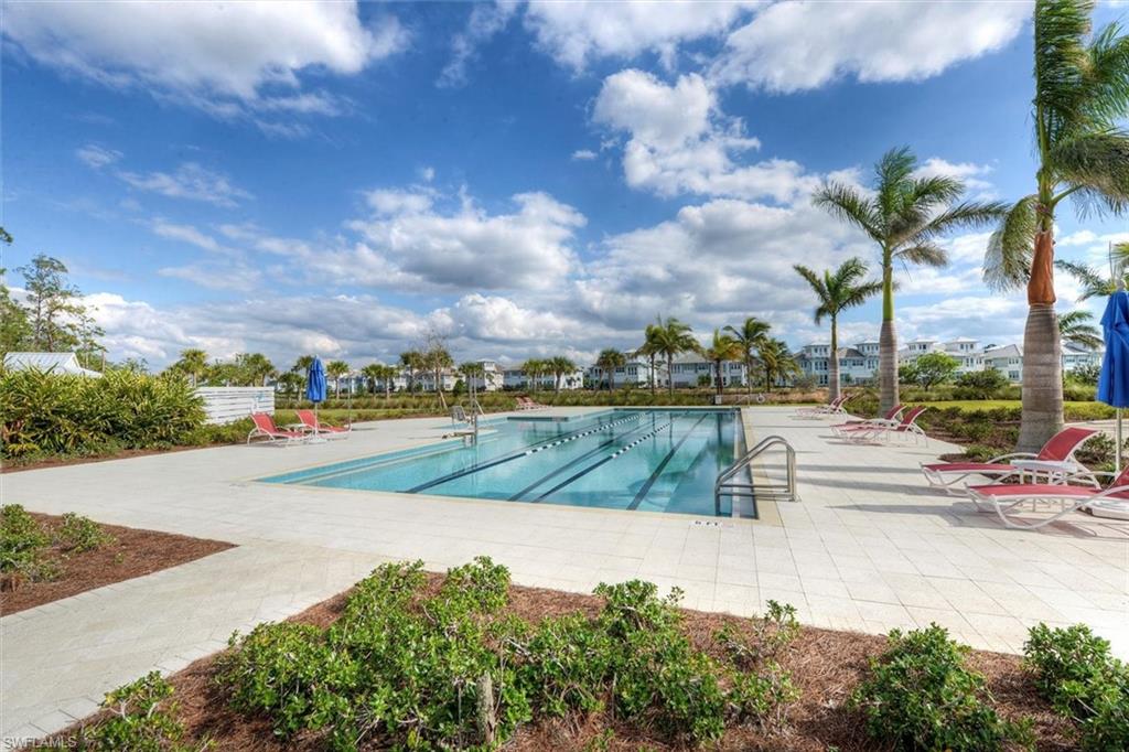 7150 Saona Court Naples, FL 34113 - Photo 24 of 31 a view of a lake with a house