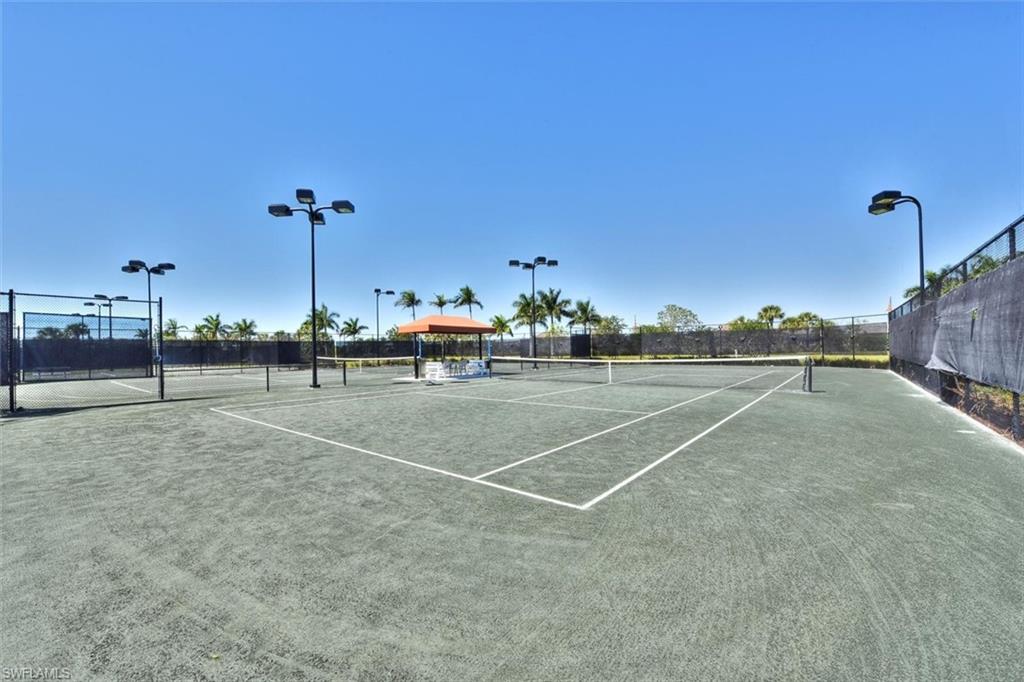7150 Saona Court Naples, FL 34113 - Photo 28 of 31 a view of a tennis court