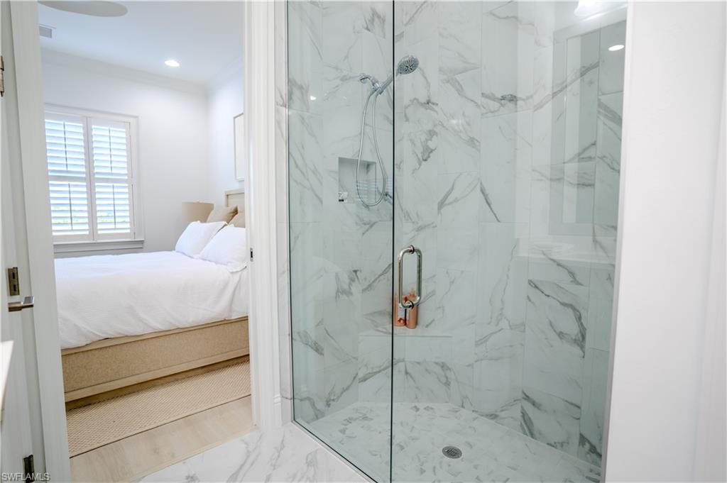 7150 Saona Court Naples, FL 34113 - Photo 8 of 31 a bathroom with a shower