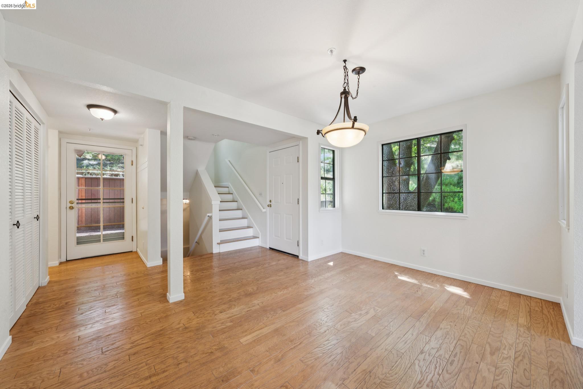 261 Redhawk Road Novato, CA 94949 - Photo 17 of 44 Hardwood flooring complements the bright white walls and trim throughout this versatile living area
