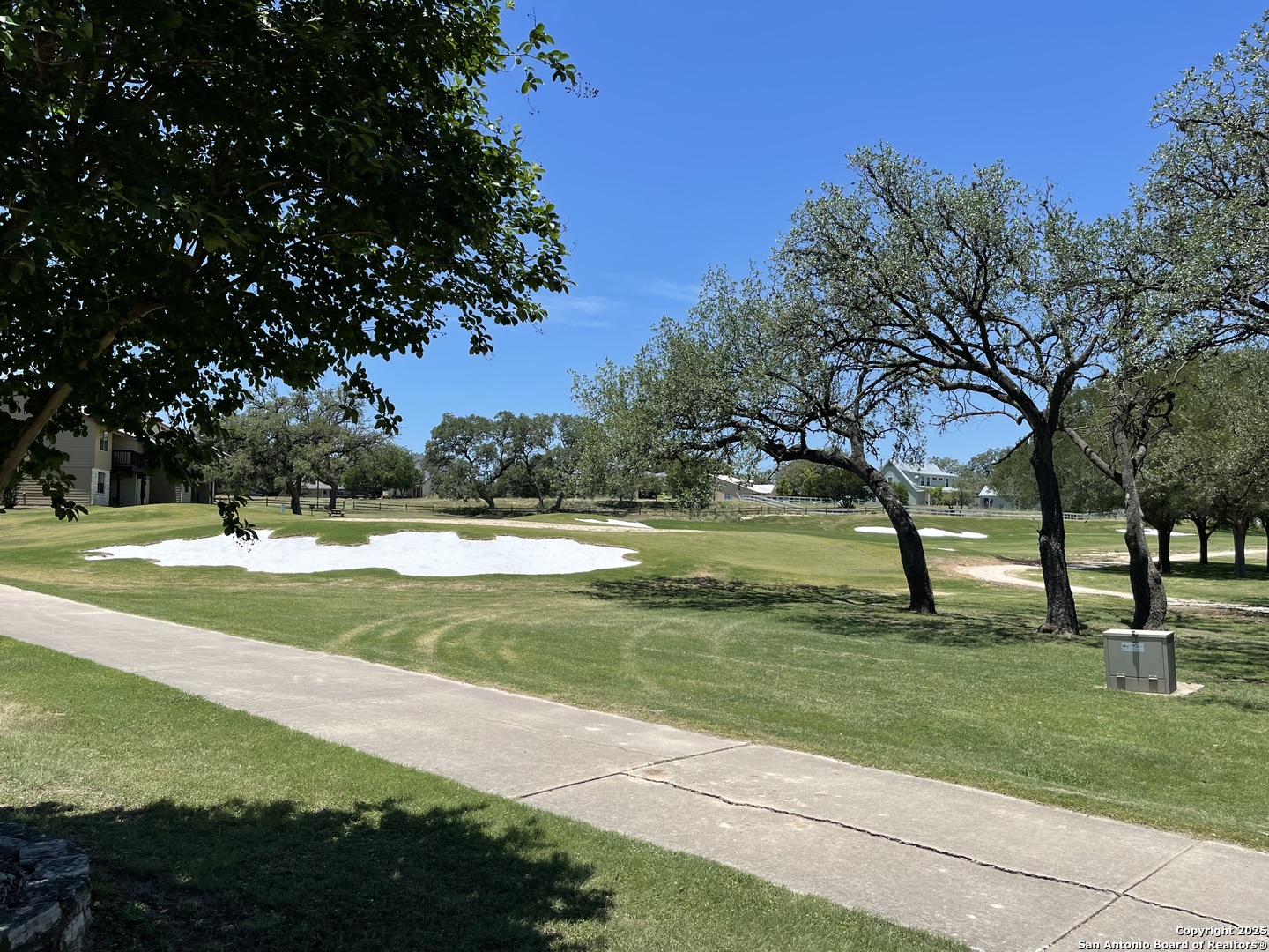 Lot 12 Brown Saddle Bandera, TX 78003 - Photo 15 of 18 a view of building with trees in the background