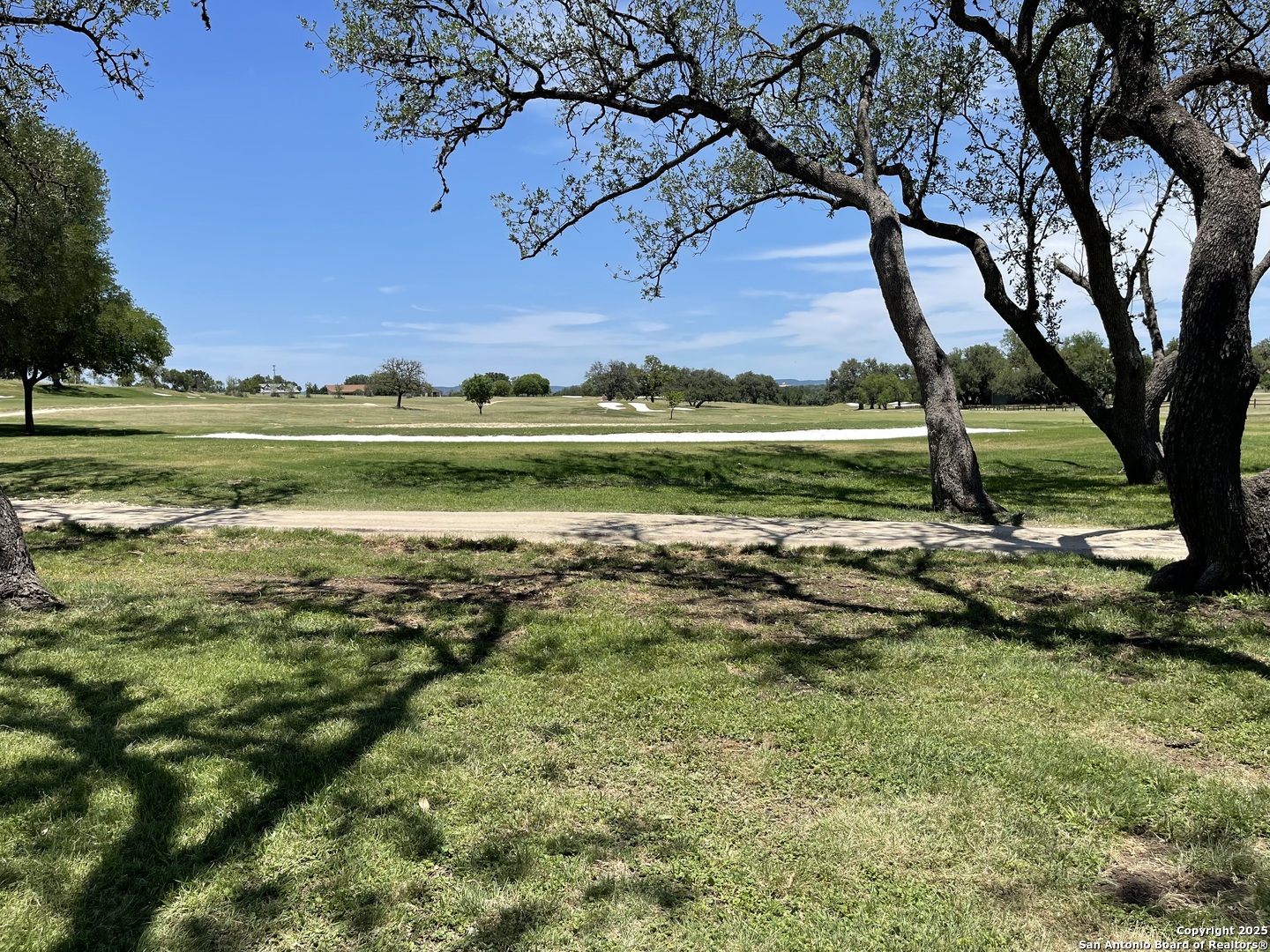 Lot 12 Brown Saddle Bandera, TX 78003 - Photo 16 of 18 a view of a golf course with a lake view