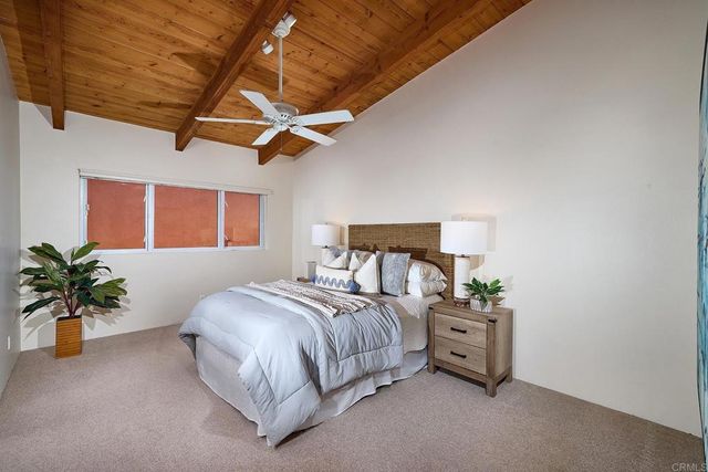 a bathroom with a toilet a sink and a mirror