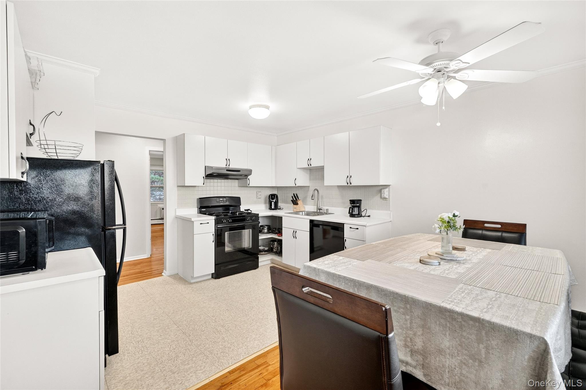 100 Dowd Street, Unit D11 Haverstraw, NY 10927 - Photo 14 of 27 a kitchen with a sink a kitchen island and stainless steel appliances