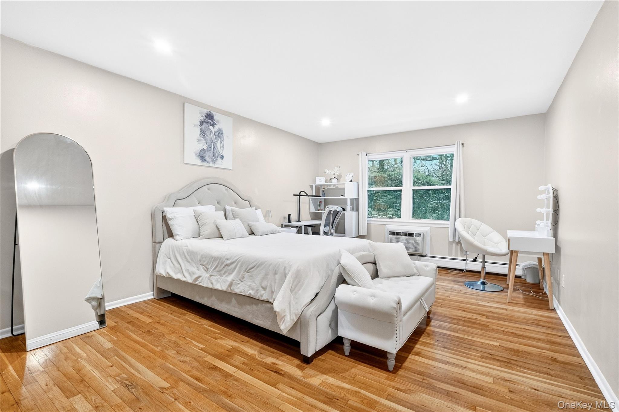 100 Dowd Street, Unit D11 Haverstraw, NY 10927 - Photo 20 of 27 a spacious bedroom with a bed a couch and large window