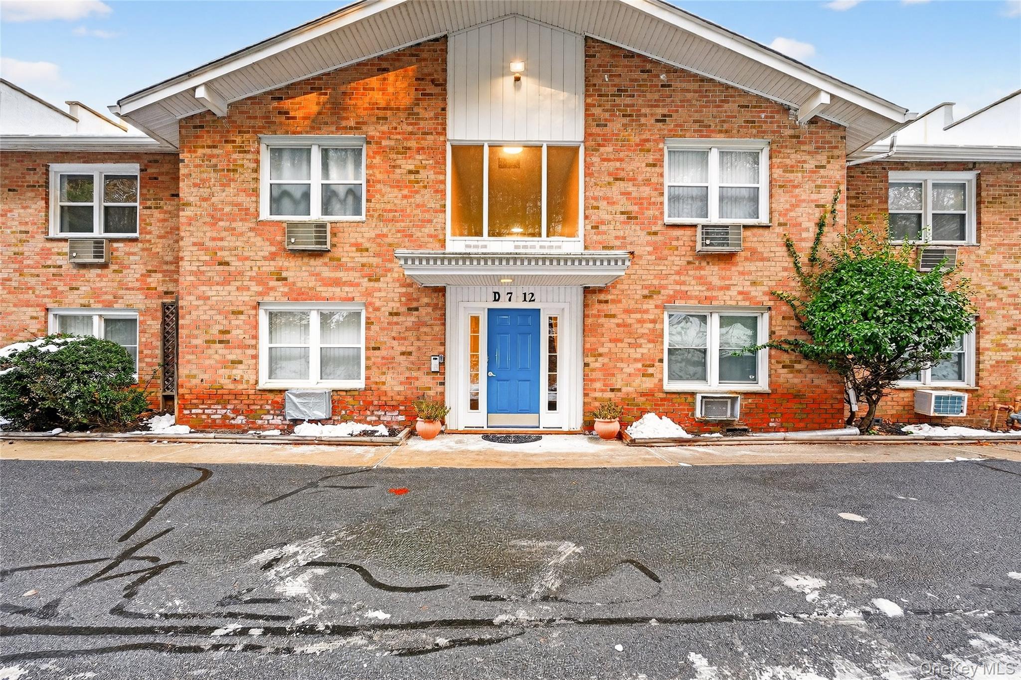 100 Dowd Street, Unit D11 Haverstraw, NY 10927 - Photo 2 of 27 front view of a brick house with a road