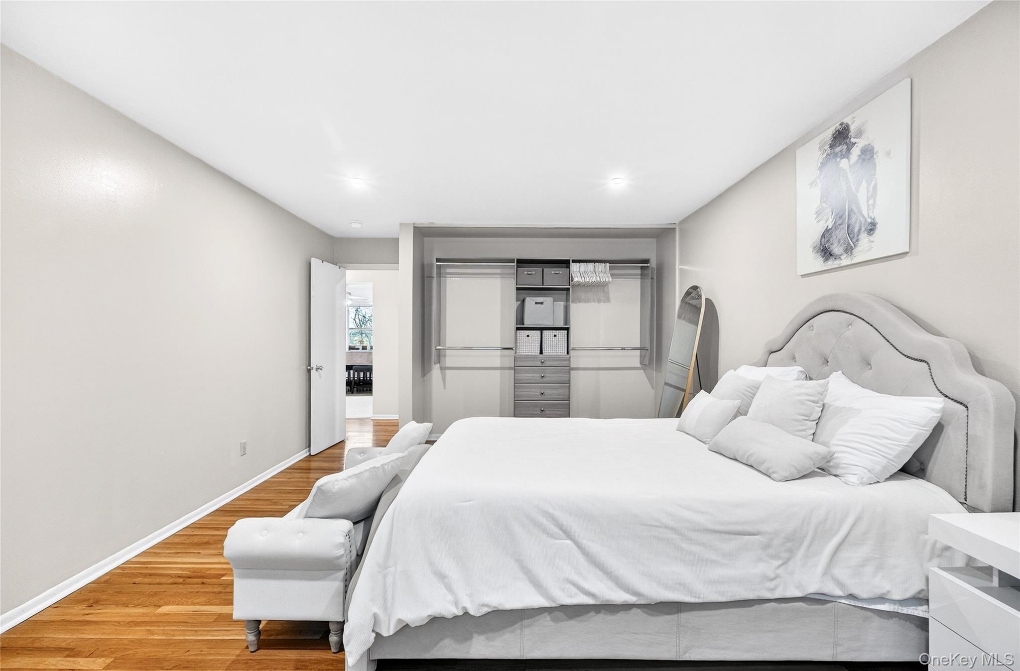 100 Dowd Street, Unit D11 Haverstraw, NY 10927 - Photo 22 of 27 a bedroom with a bed and chair