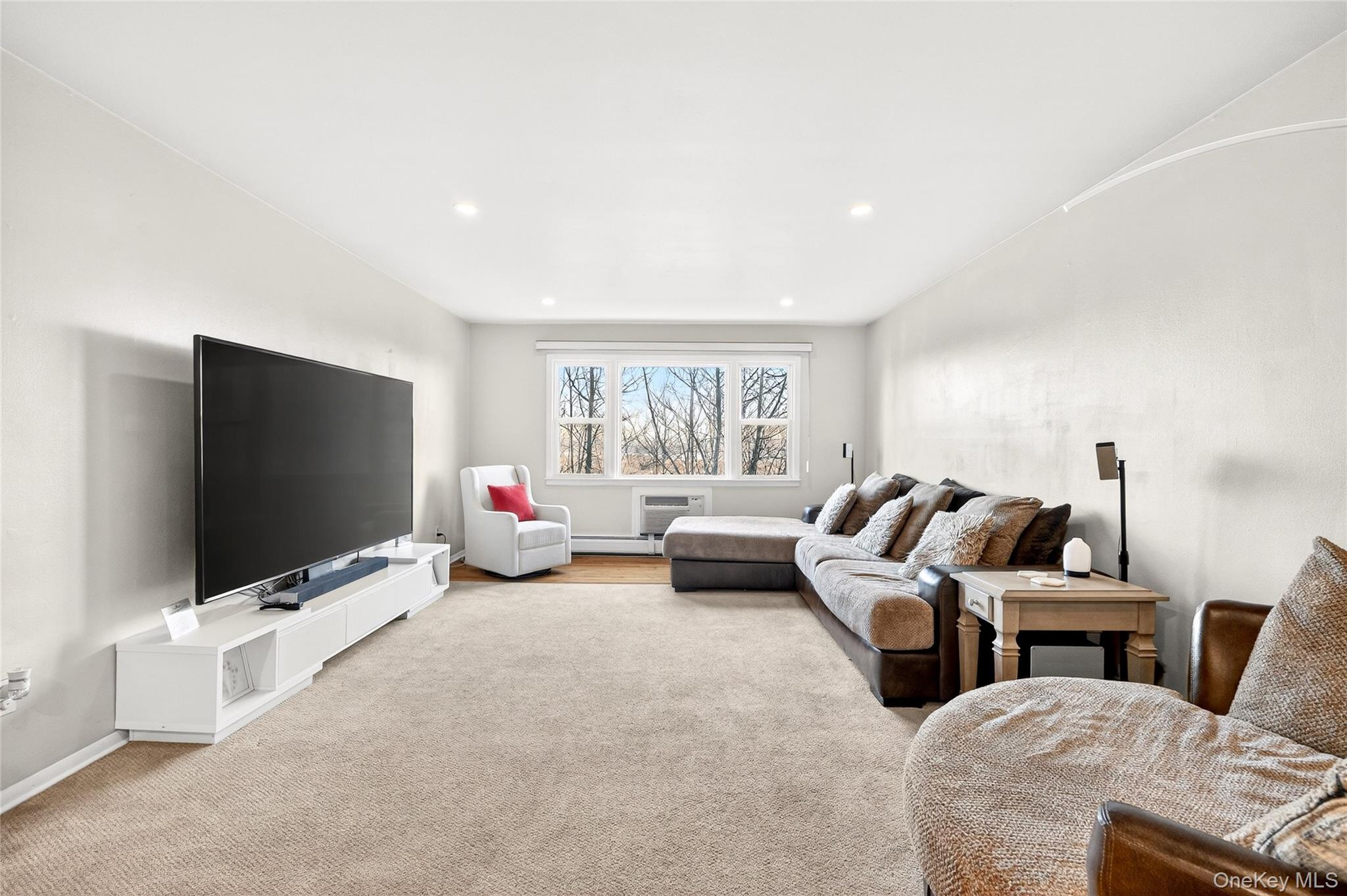 100 Dowd Street, Unit D11 Haverstraw, NY 10927 - Photo 5 of 27 a living room with furniture and a flat screen tv