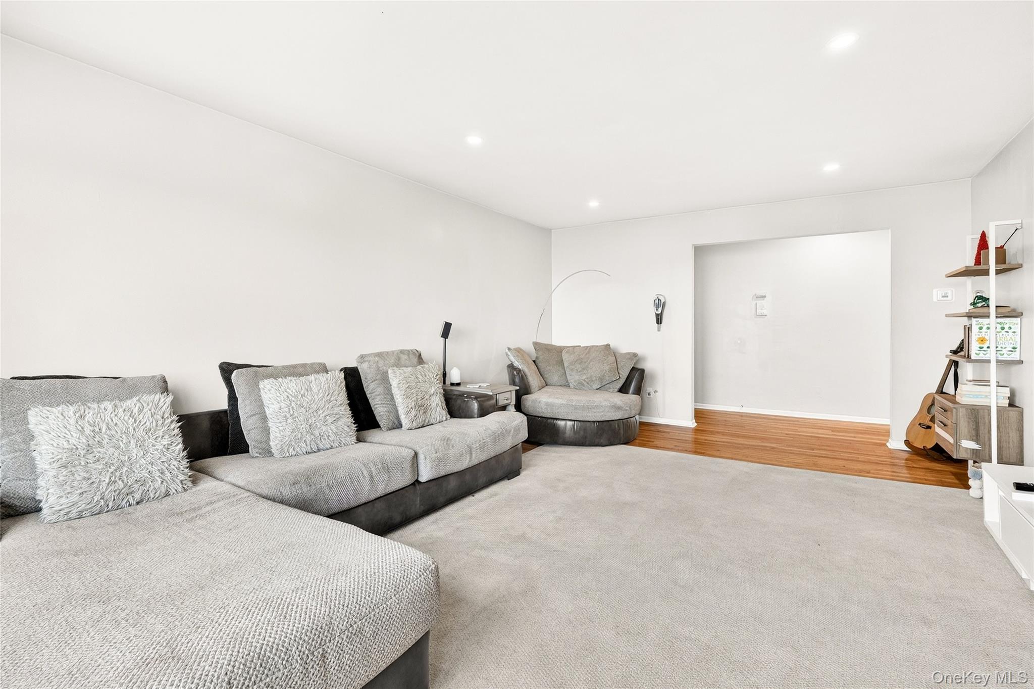 100 Dowd Street, Unit D11 Haverstraw, NY 10927 - Photo 8 of 27 a living room with furniture and a rug