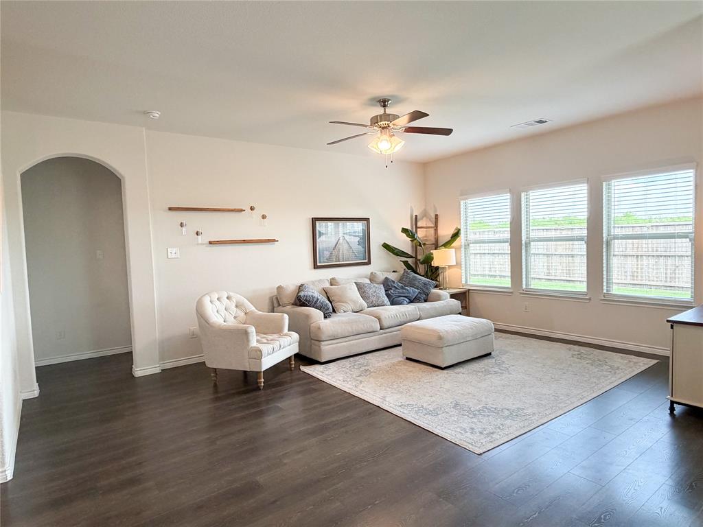 929 Philadelphia Street Fate, TX 75189 - Photo 12 of 34 a living room with furniture wooden floor and a window