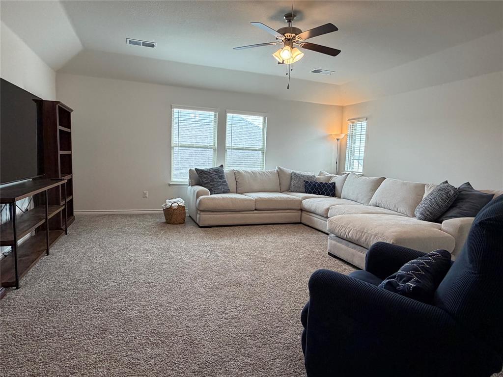 929 Philadelphia Street Fate, TX 75189 - Photo 14 of 34 a living room with furniture and a flat screen tv