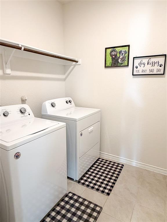929 Philadelphia Street Fate, TX 75189 - Photo 27 of 34 a utility room with dryer and washer