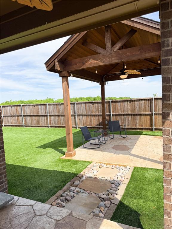 929 Philadelphia Street Fate, TX 75189 - Photo 3 of 34 a view of a backyard with sitting area