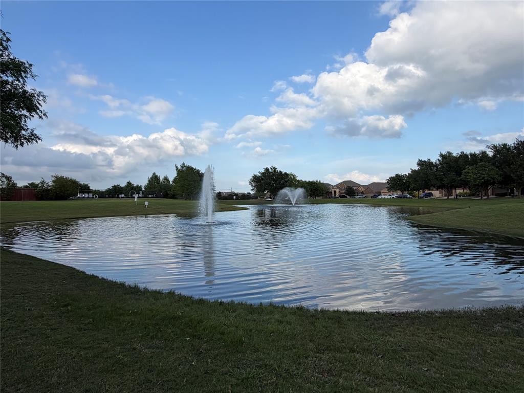 929 Philadelphia Street Fate, TX 75189 - Photo 30 of 34 a view of a lake with houses in the back