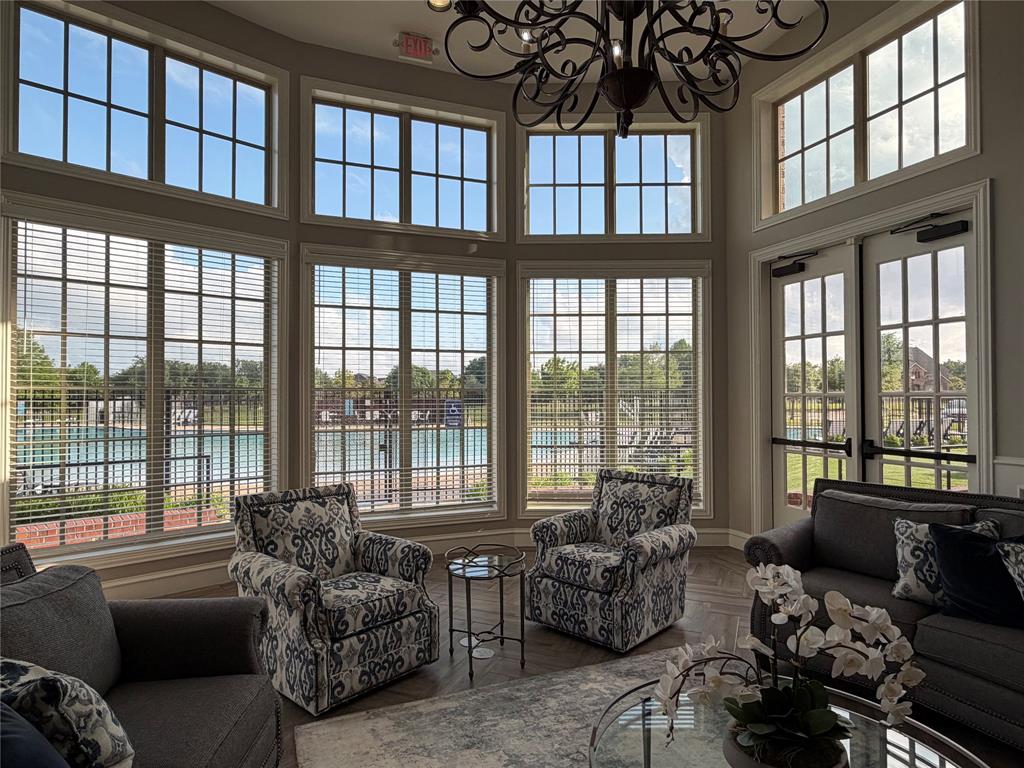 929 Philadelphia Street Fate, TX 75189 - Photo 32 of 34 a living room with furniture and a large window