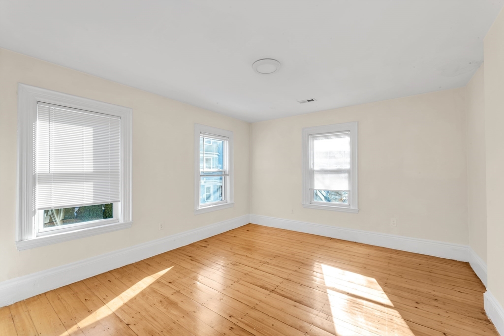 53 Brookside Avenue Boston, MA 02130 - Photo 17 of 28 a view of an empty room with a window
