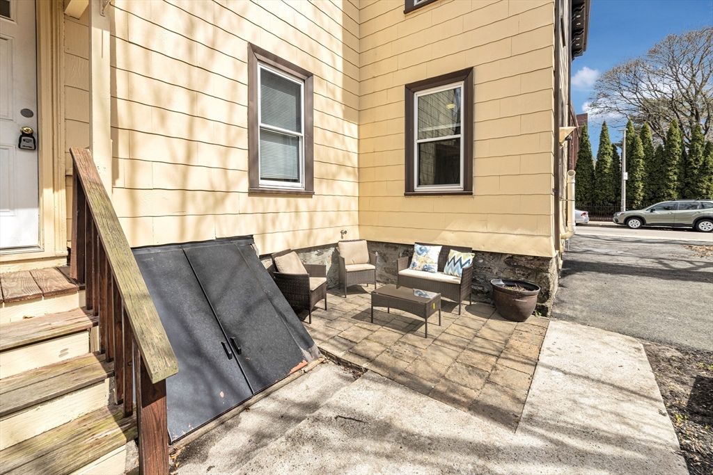 53 Brookside Avenue Boston, MA 02130 - Photo 23 of 28 a building outdoor space with patio furniture