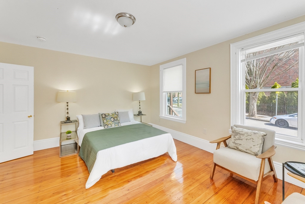 53 Brookside Avenue Boston, MA 02130 - Photo 5 of 28 a bedroom with a bed and a chair