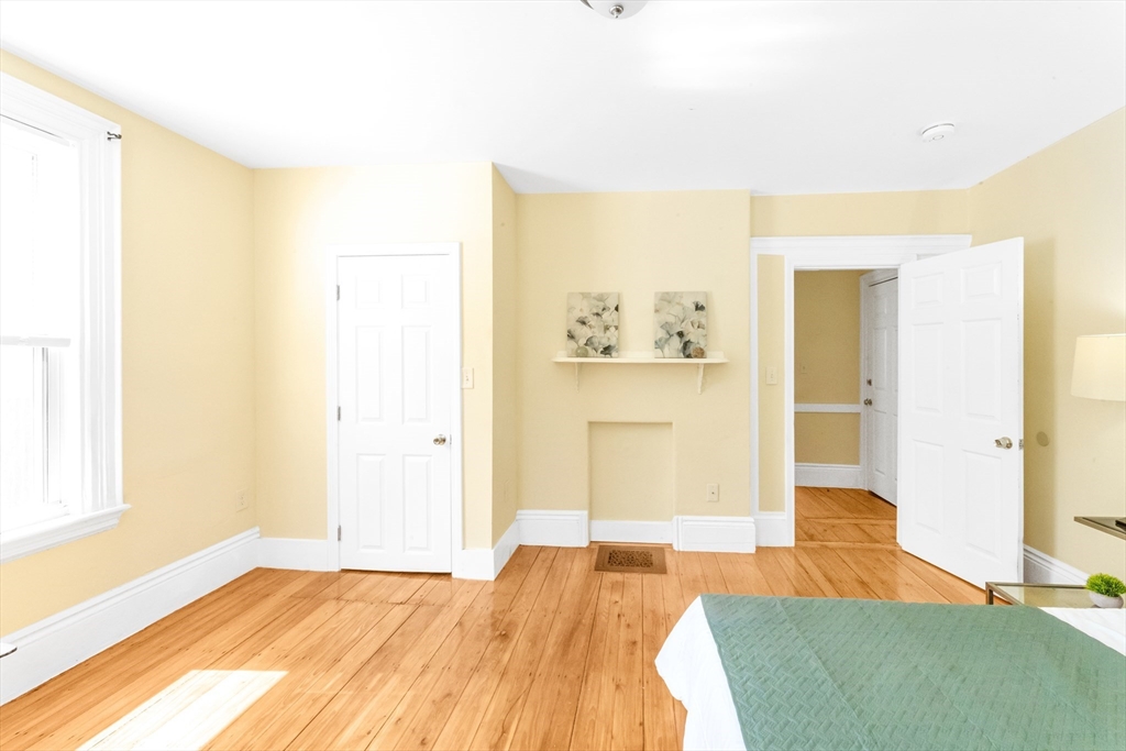 53 Brookside Avenue Boston, MA 02130 - Photo 6 of 28 a bedroom with a bed and a painting