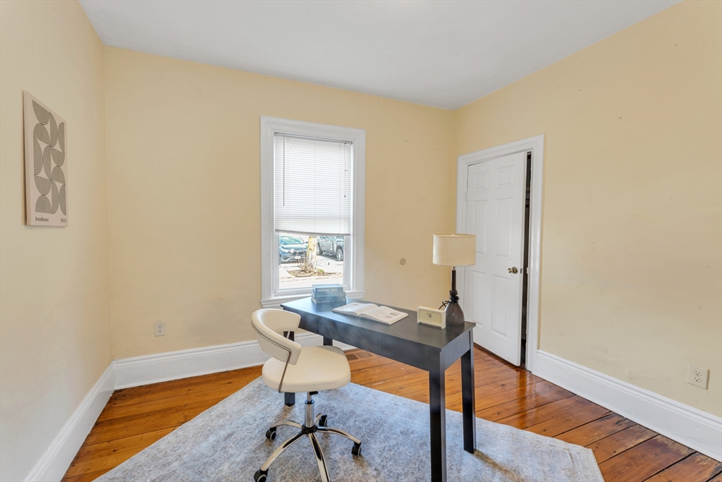 53 Brookside Avenue Boston, MA 02130 - Photo 7 of 28 a view of a workspace with furniture and a window