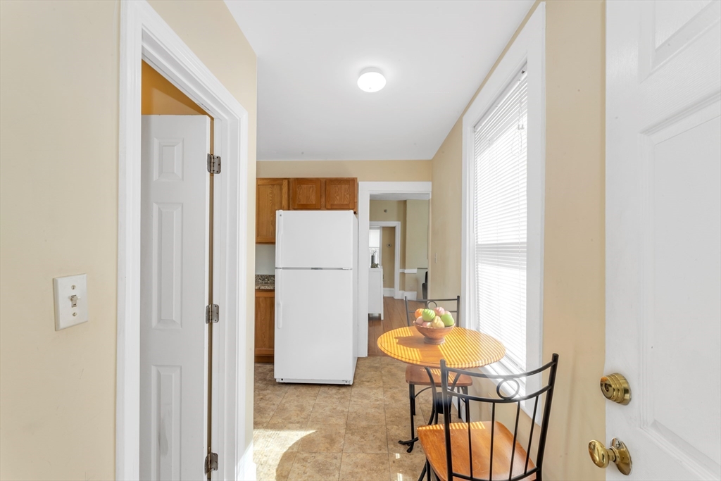 53 Brookside Avenue Boston, MA 02130 - Photo 10 of 28 a view of a hallway to a livingroom with furniture and a window
