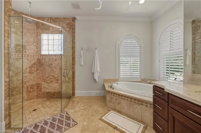 a bath room with a bath tub and shower