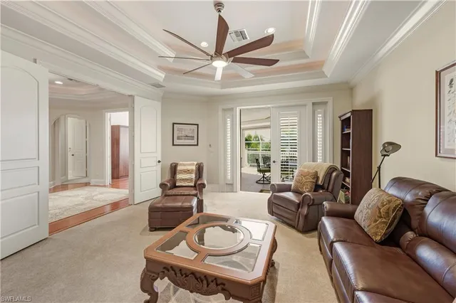 a living room with furniture a large window with wooden floor