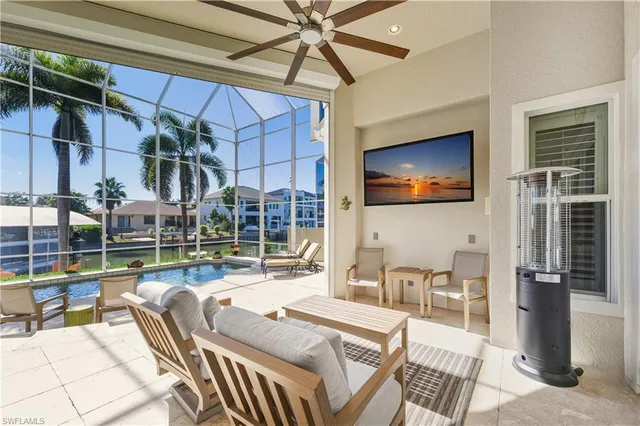 a outdoor space with lots of white furniture