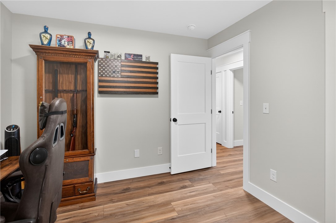 106 Bolt Road Townville, SC 29689 - Photo 23 of 33 A versatile space featuring wood plank flooring and crisp white trim.
