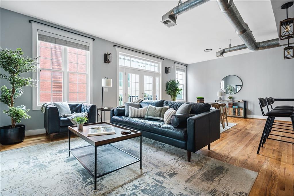 1029 Piedmont Avenue Northeast, Unit 303 Atlanta, GA 30309 - Photo 15 of 44 a living room with furniture and windows
