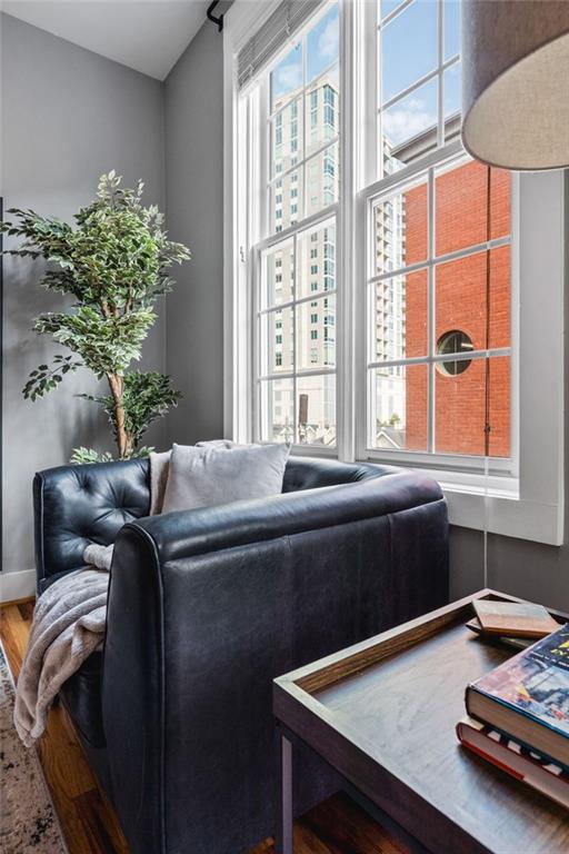 1029 Piedmont Avenue Northeast, Unit 303 Atlanta, GA 30309 - Photo 16 of 44 a living room with a table chair and a window