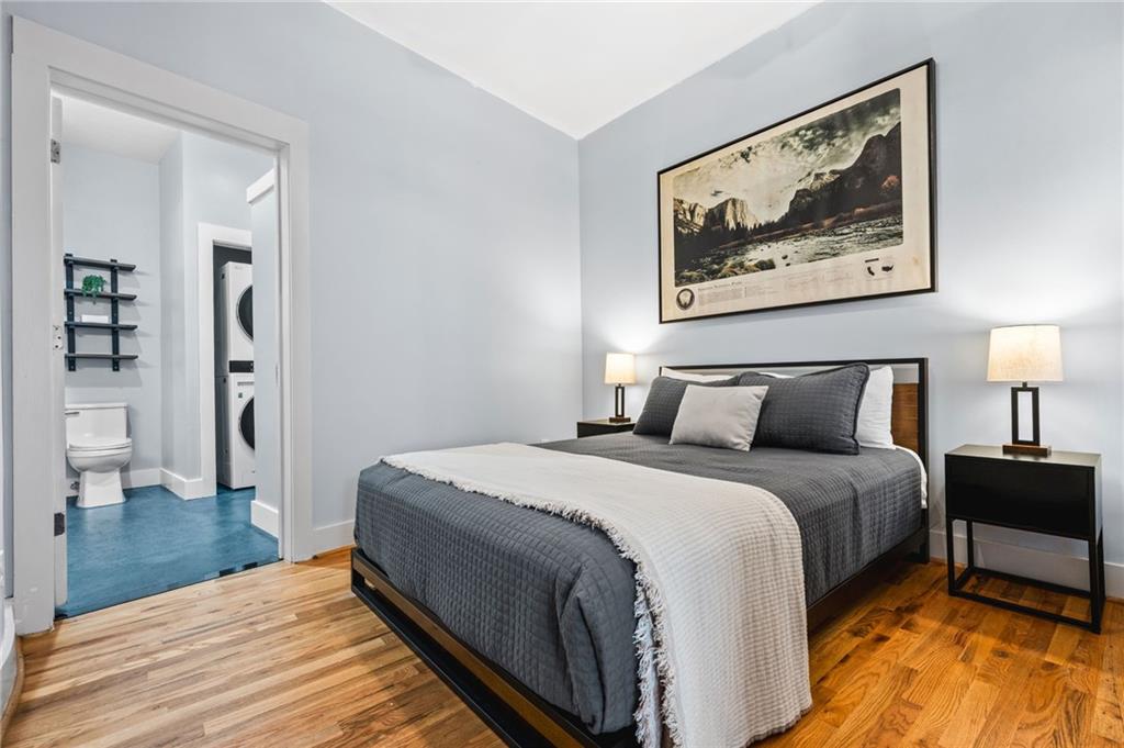 1029 Piedmont Avenue Northeast, Unit 303 Atlanta, GA 30309 - Photo 17 of 44 a bed room with a bed and a lamp