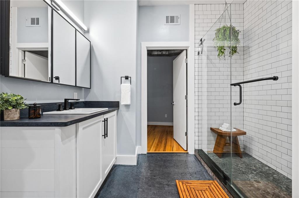 1029 Piedmont Avenue Northeast, Unit 303 Atlanta, GA 30309 - Photo 21 of 44 a view of bathroom with a sink and mirror