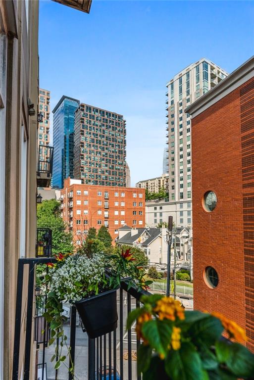 1029 Piedmont Avenue Northeast, Unit 303 Atlanta, GA 30309 - Photo 26 of 44 a view of a balcony with city