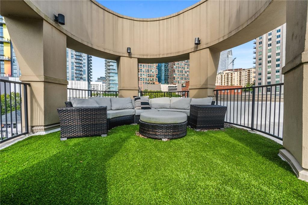 1029 Piedmont Avenue Northeast, Unit 303 Atlanta, GA 30309 - Photo 30 of 44 a living room with furniture and a large window