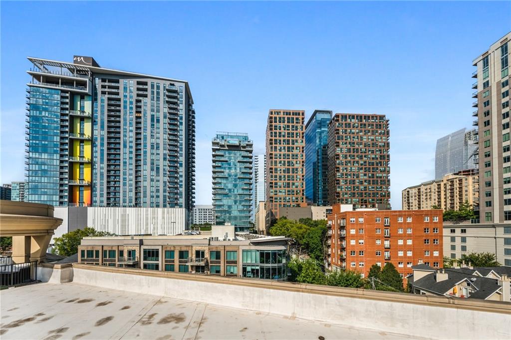 1029 Piedmont Avenue Northeast, Unit 303 Atlanta, GA 30309 - Photo 31 of 44 a front view of a building with a street