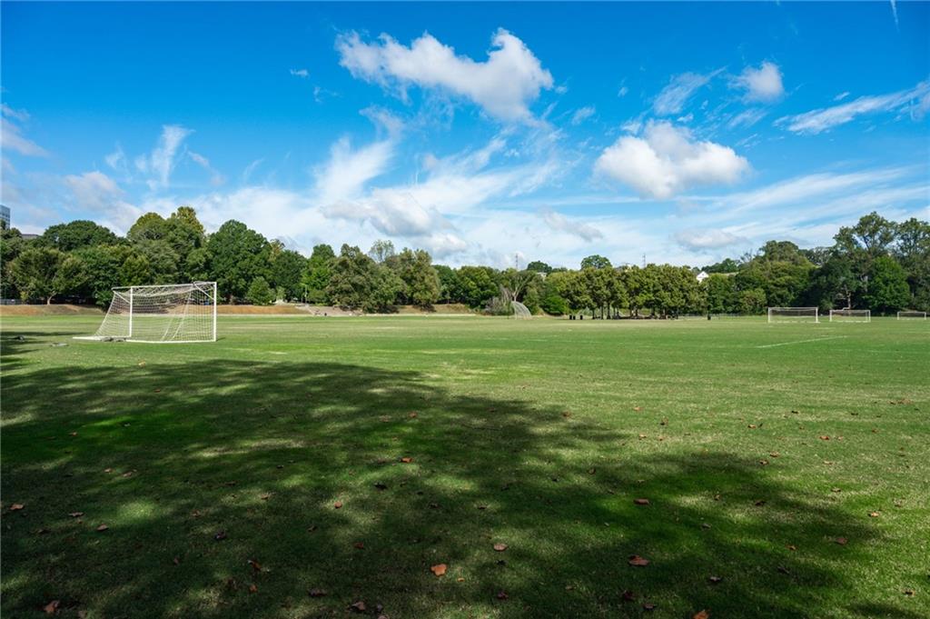 1029 Piedmont Avenue Northeast, Unit 303 Atlanta, GA 30309 - Photo 36 of 44 a view of a green field with wooden fence