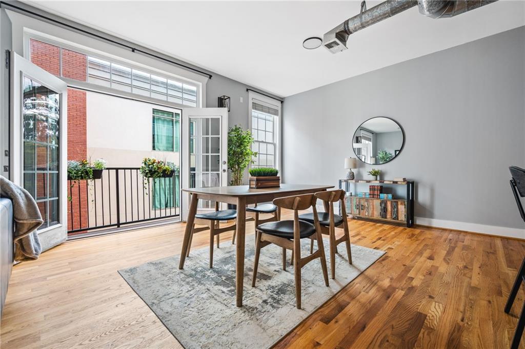 1029 Piedmont Avenue Northeast, Unit 303 Atlanta, GA 30309 - Photo 4 of 44 a dining room with furniture and wooden floor