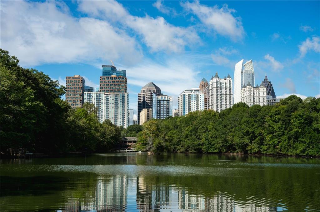 1029 Piedmont Avenue Northeast, Unit 303 Atlanta, GA 30309 - Photo 42 of 44 a view of a lake with a building in the background