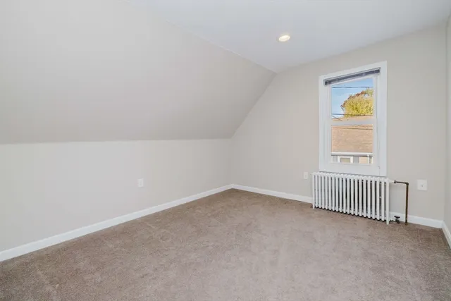 a bathroom with a sink a toilet and a shower