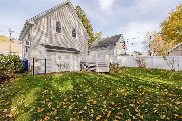 a view of a house with a small yard and plants