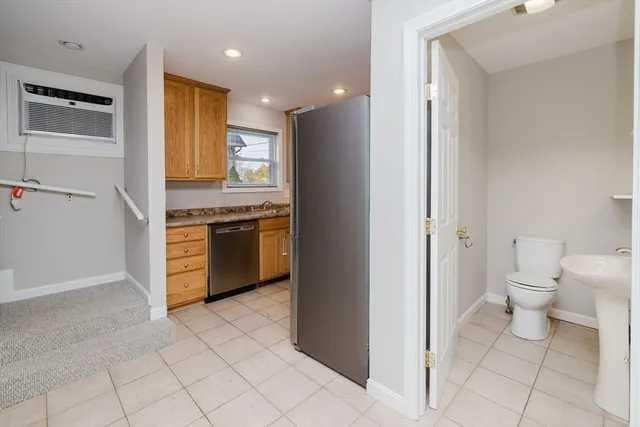 a kitchen with a stove a sink and a refrigerator