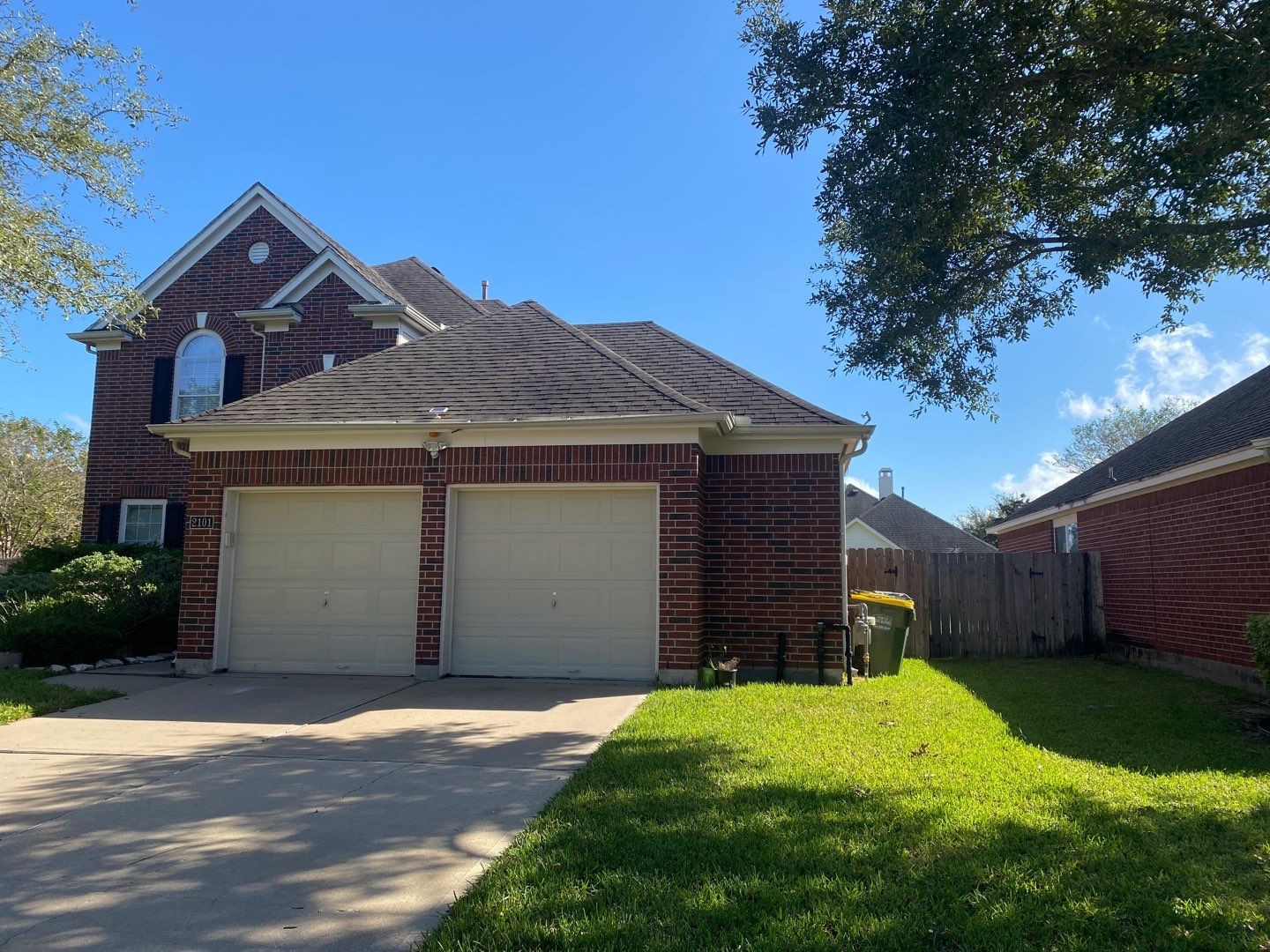 2101 Crestwind Court Pearland, TX 77584 - Photo 2 of 41 a front view of a house with a yard and garage
