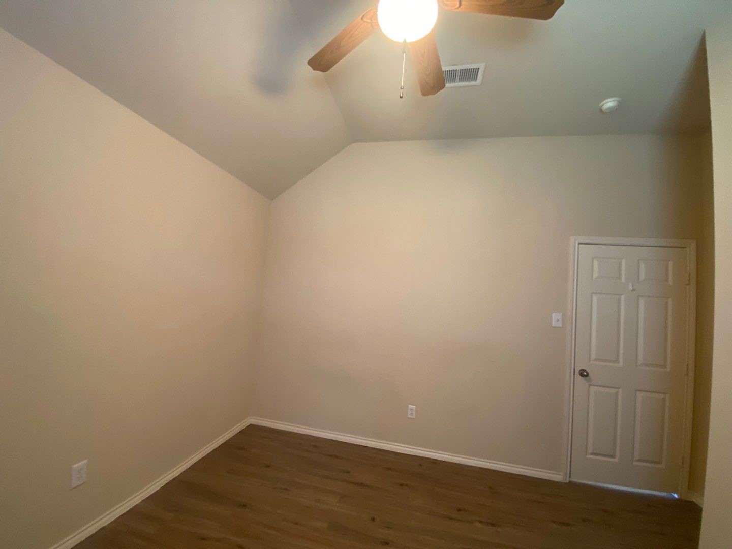 2101 Crestwind Court Pearland, TX 77584 - Photo 25 of 41 a view of a room with wooden floor and fan