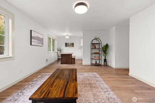 a view of an empty room and fire place
