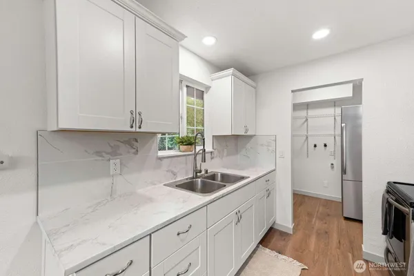 a kitchen with a sink and cabinets
